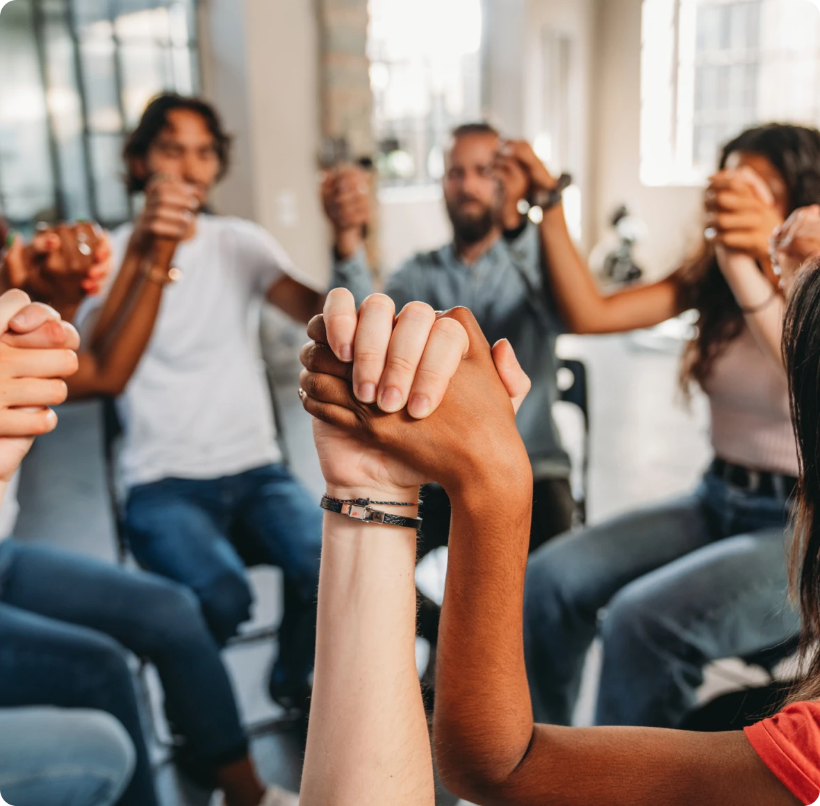Group holding hands in a circle
