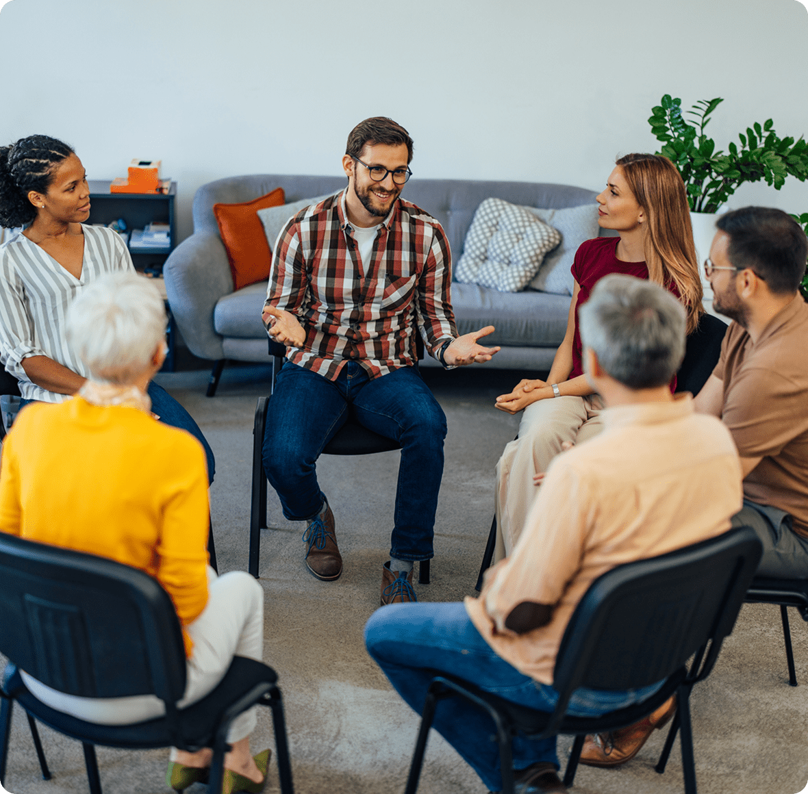 People in a supportive circle meeting