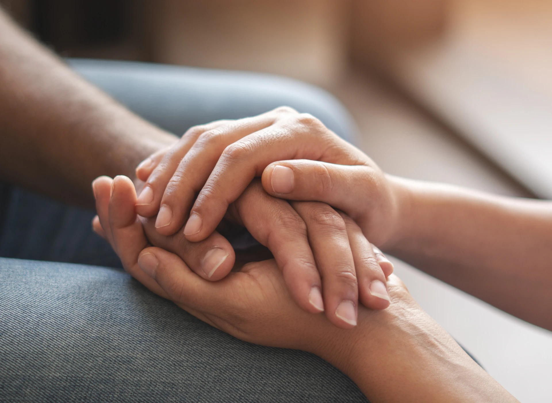 Holding hands showing support